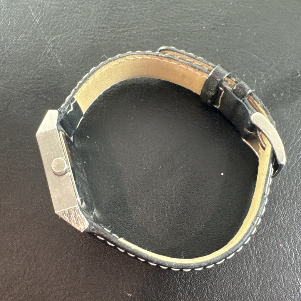 Paul Frank Julius square watch with black dial, stainless steel case, and black leather strap