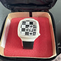 2002 Sanrio Hello Kitty watch with black and white checkerboard face, original zippered case, and tags.