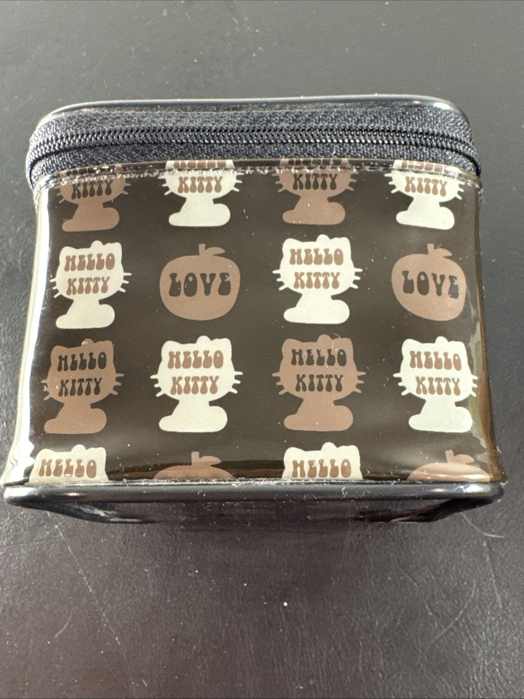 2002 Sanrio Hello Kitty watch with black and white checkerboard face, original zippered case, and tags.