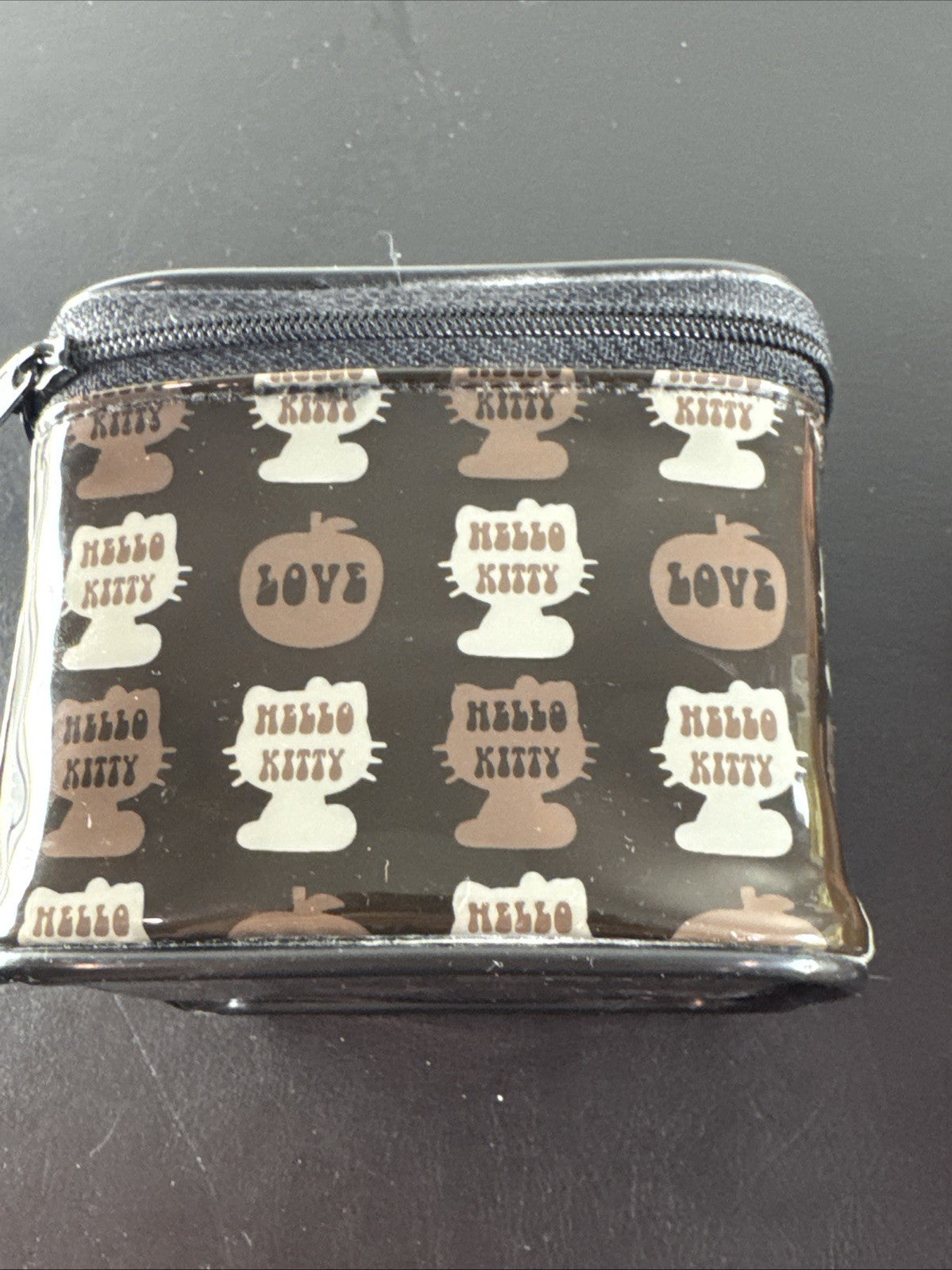 2002 Sanrio Hello Kitty watch with black and white checkerboard face, original zippered case, and tags.