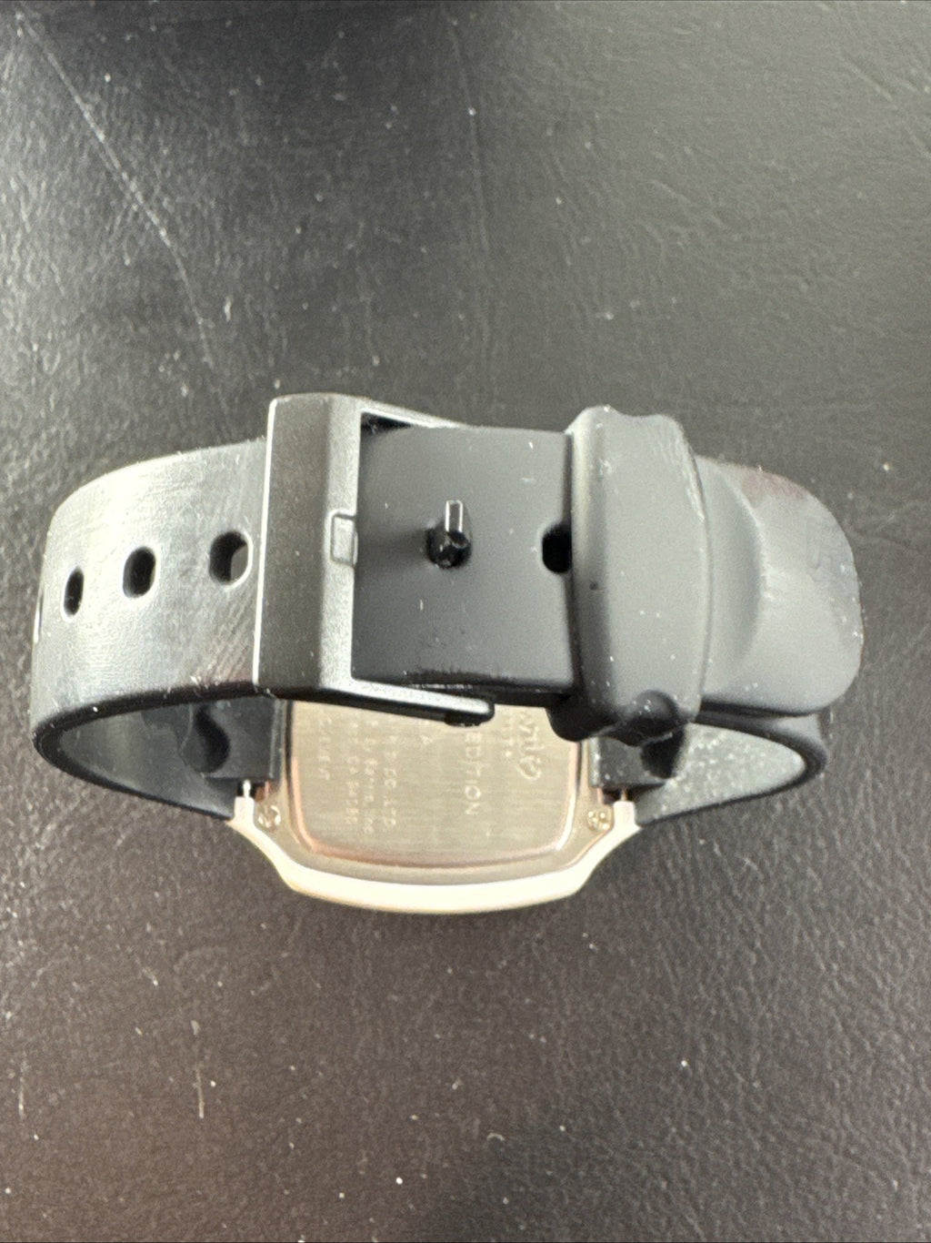 2002 Sanrio Hello Kitty watch with black and white checkerboard face, original zippered case, and tags.