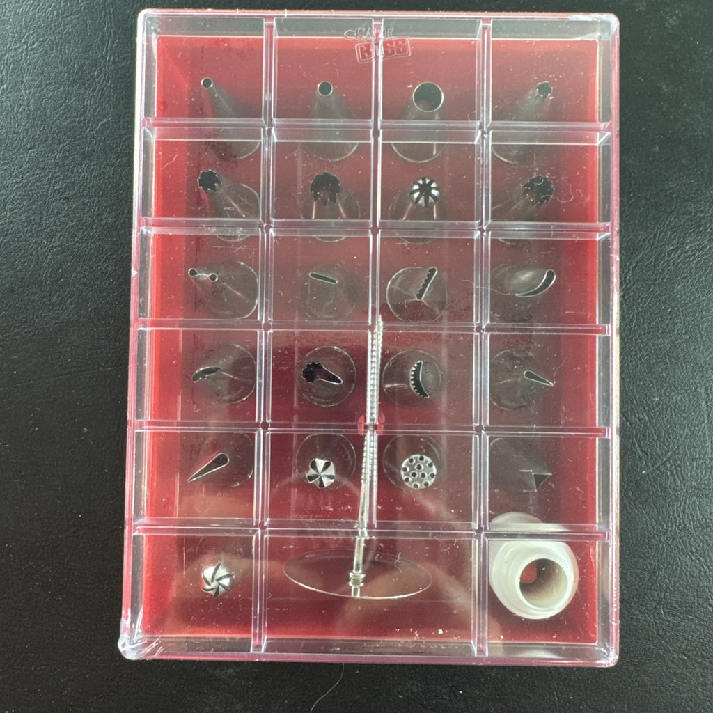 Cake Boss 24-piece stainless steel cake decorating tip set with plastic storage case, brand new.