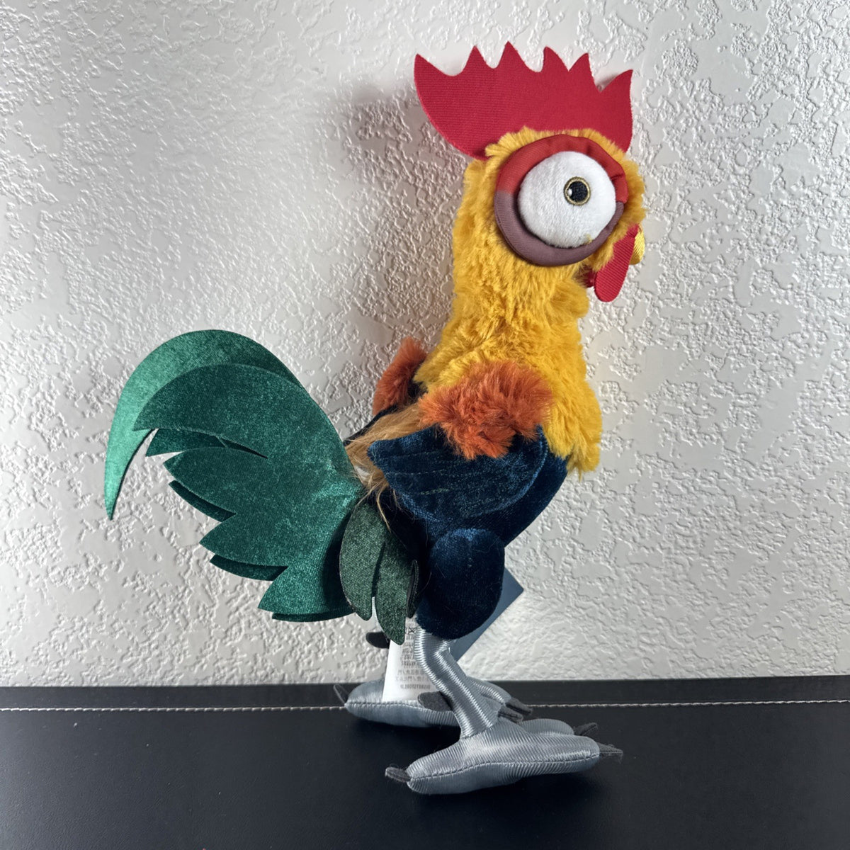 Disney Store Moana 12-inch Hei Hei rooster plush toy with original tags attached.