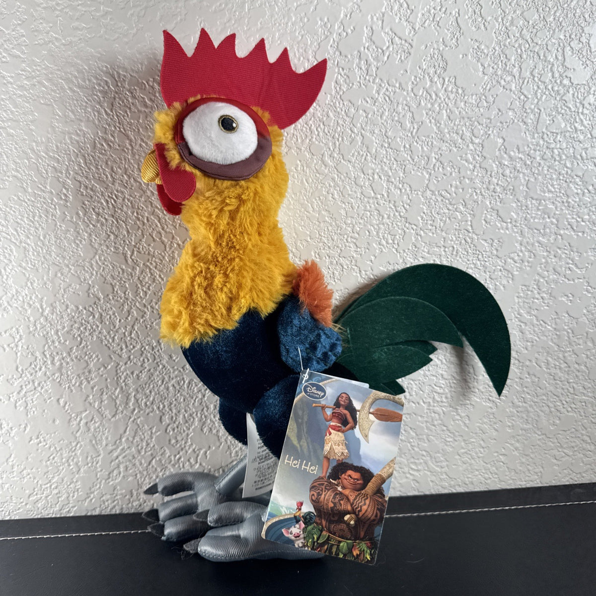 Disney Store Moana 12-inch Hei Hei rooster plush toy with original tags attached.