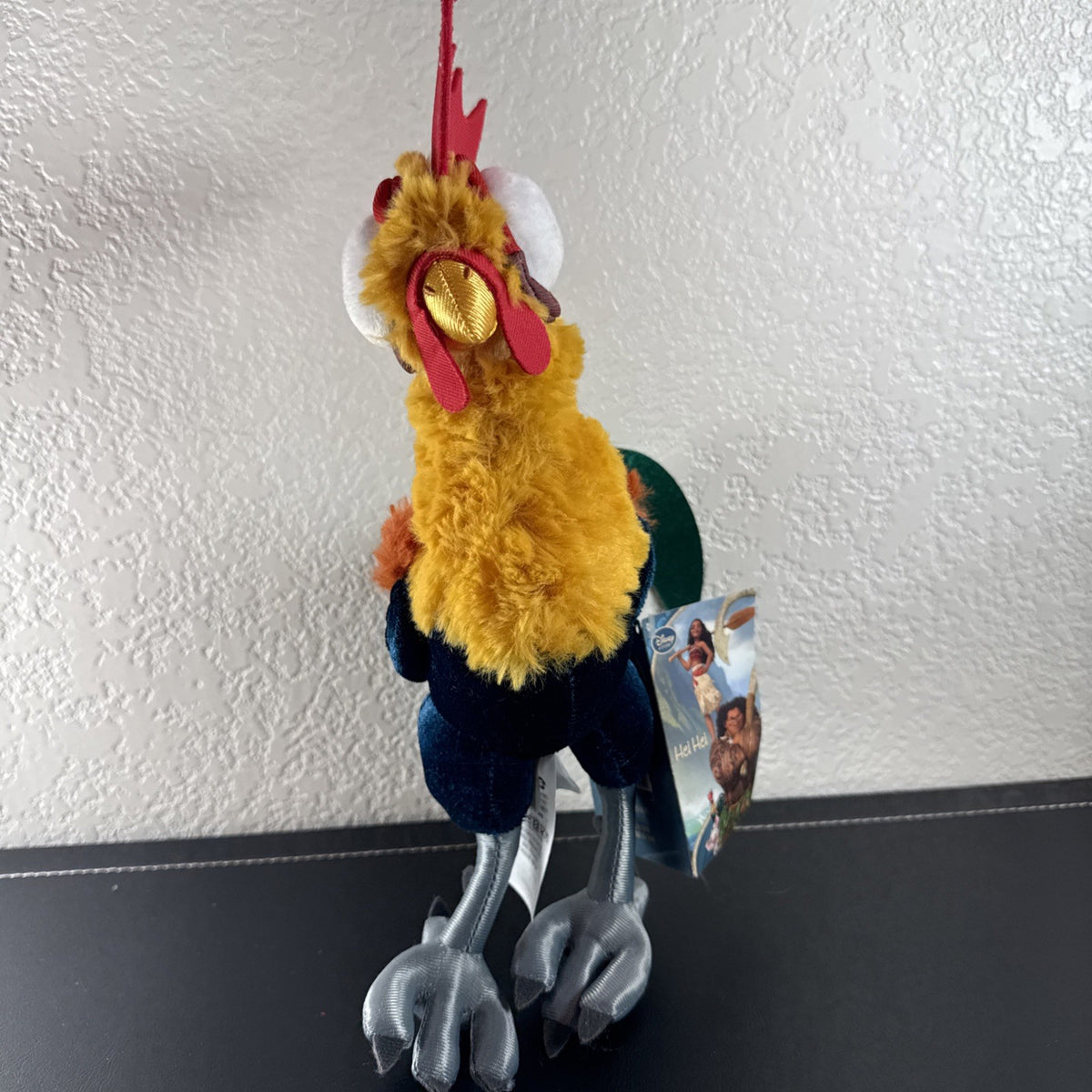 Disney Store Moana 12-inch Hei Hei rooster plush toy with original tags attached.