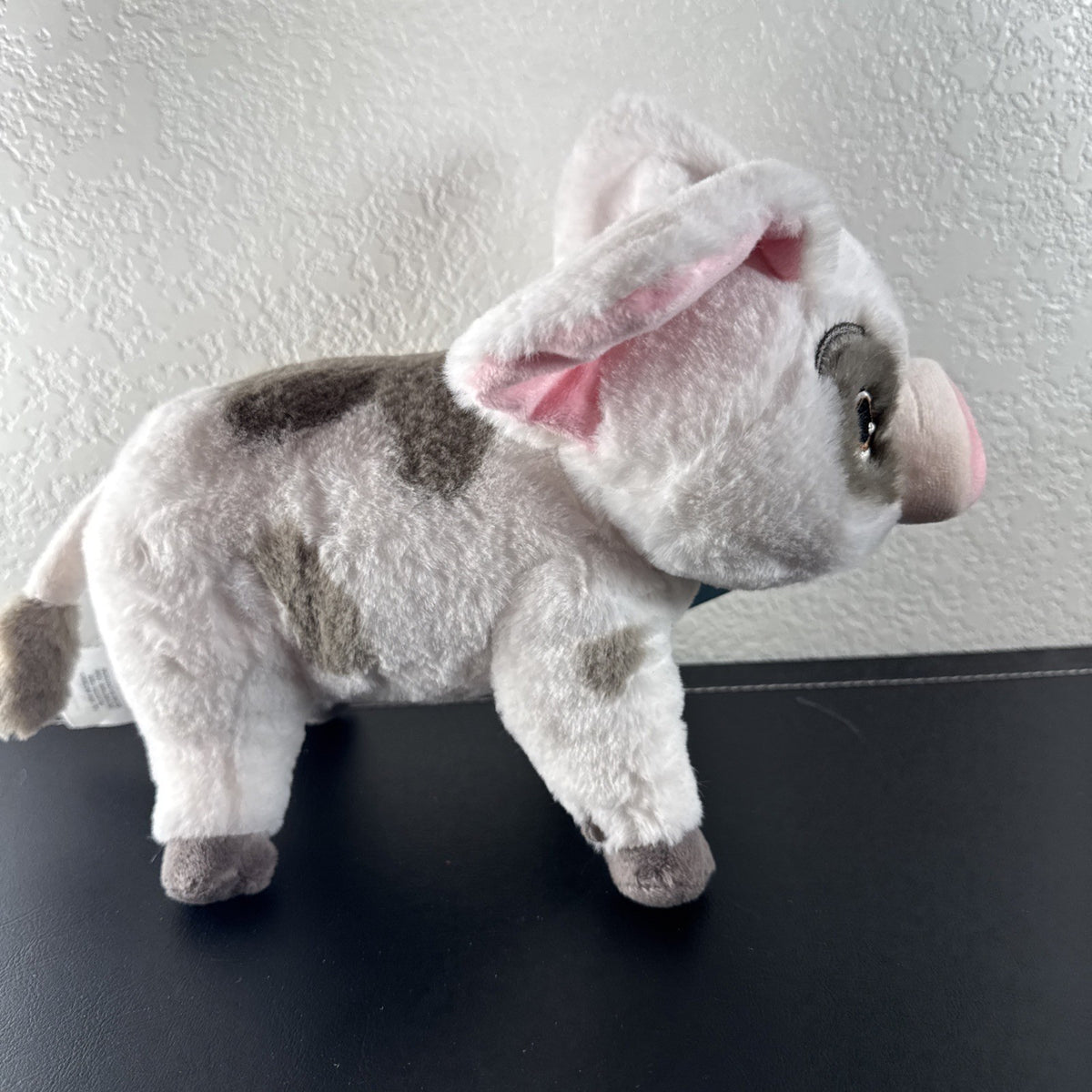Official Disney Store 10-inch standing Pua pig plush from Moana with original tags attached.