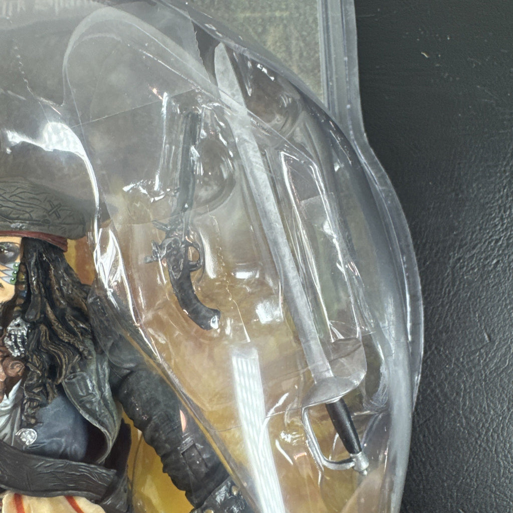 New 2006 Disney Pirates of the Caribbean Dead Man's Chest 7-inch Captain Jack Sparrow action figure with accessories.