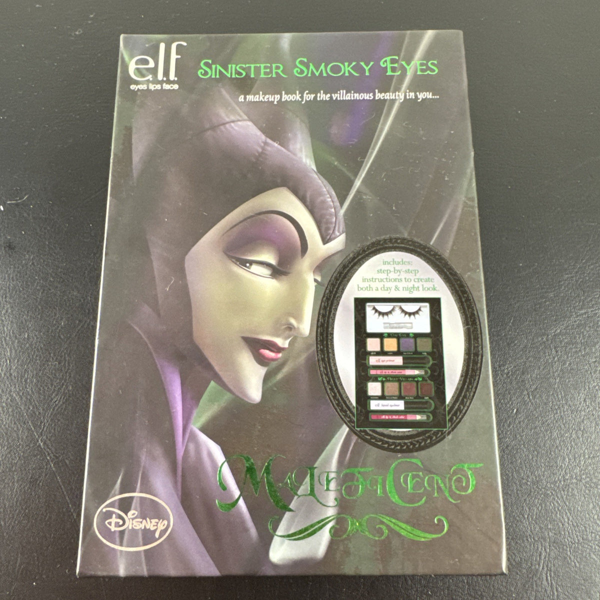 New e.l.f. Disney Maleficent Sinister Smoky Eyes Makeup Book containing eyeshadow, face powder, highlighter, and lip gloss