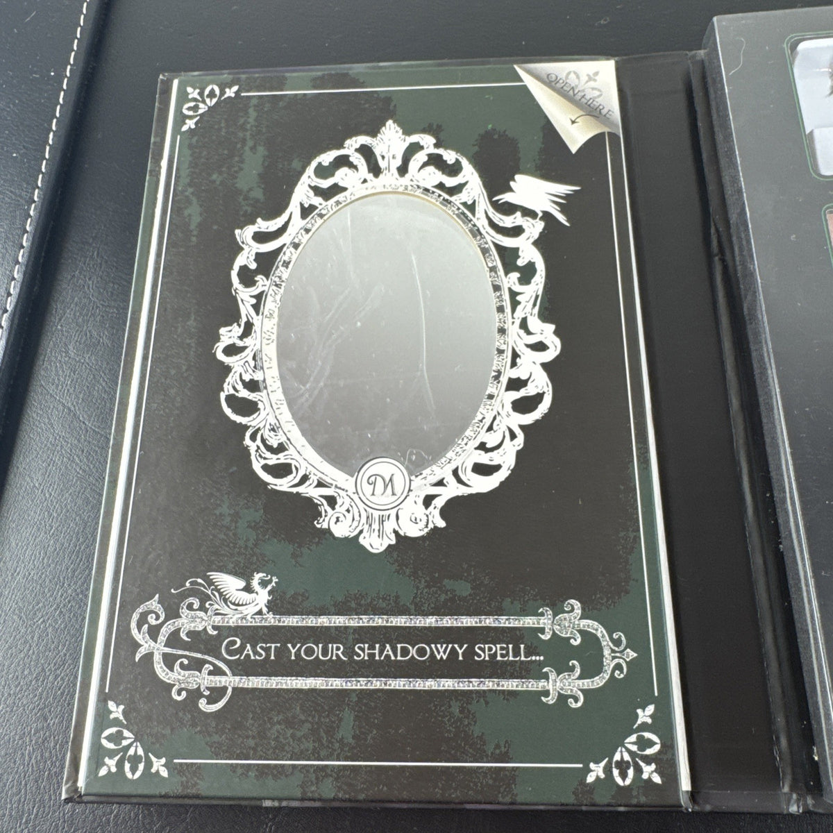 New e.l.f. Disney Maleficent Sinister Smoky Eyes Makeup Book containing eyeshadow, face powder, highlighter, and lip gloss