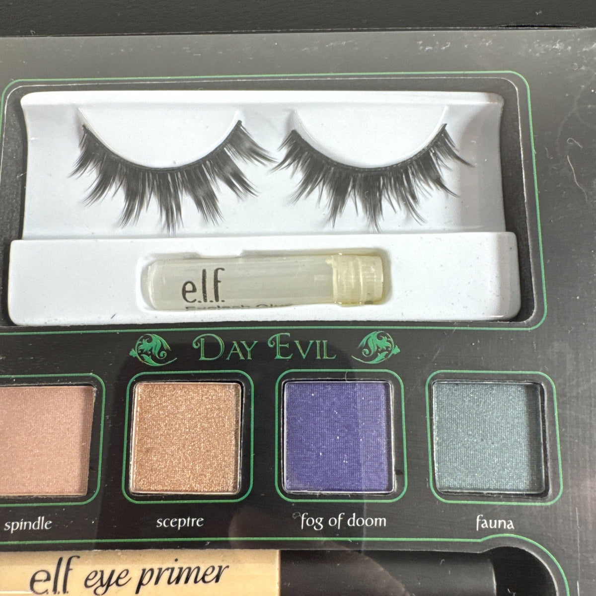 New e.l.f. Disney Maleficent Sinister Smoky Eyes Makeup Book containing eyeshadow, face powder, highlighter, and lip gloss