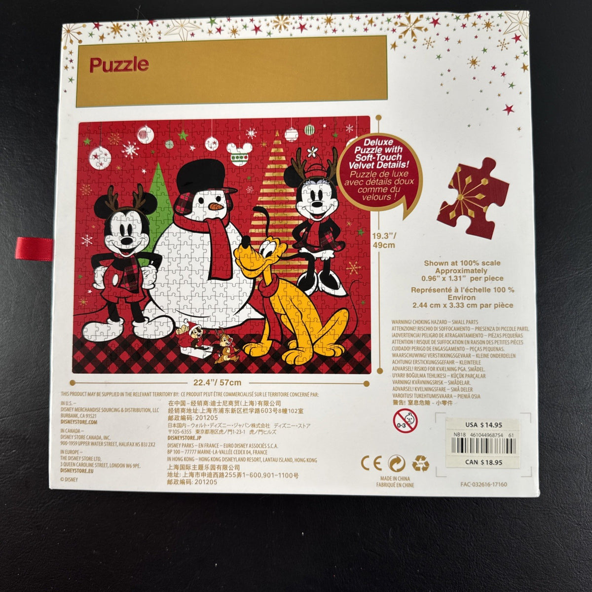 New Disney Store 500-piece Christmas jigsaw puzzle featuring Mickey Mouse, Minnie Mouse, Pluto, and a snowman.