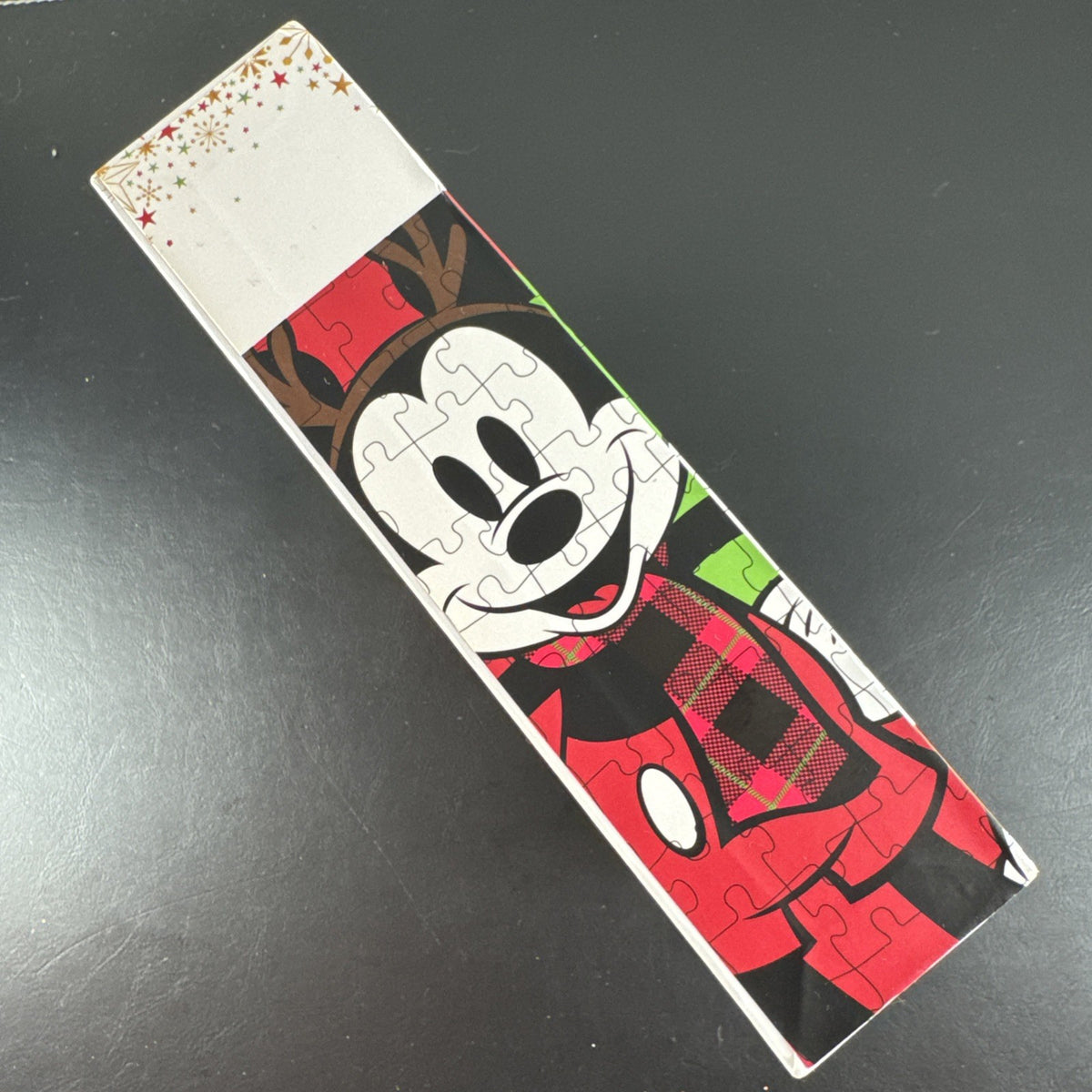 New Disney Store 500-piece Christmas jigsaw puzzle featuring Mickey Mouse, Minnie Mouse, Pluto, and a snowman.