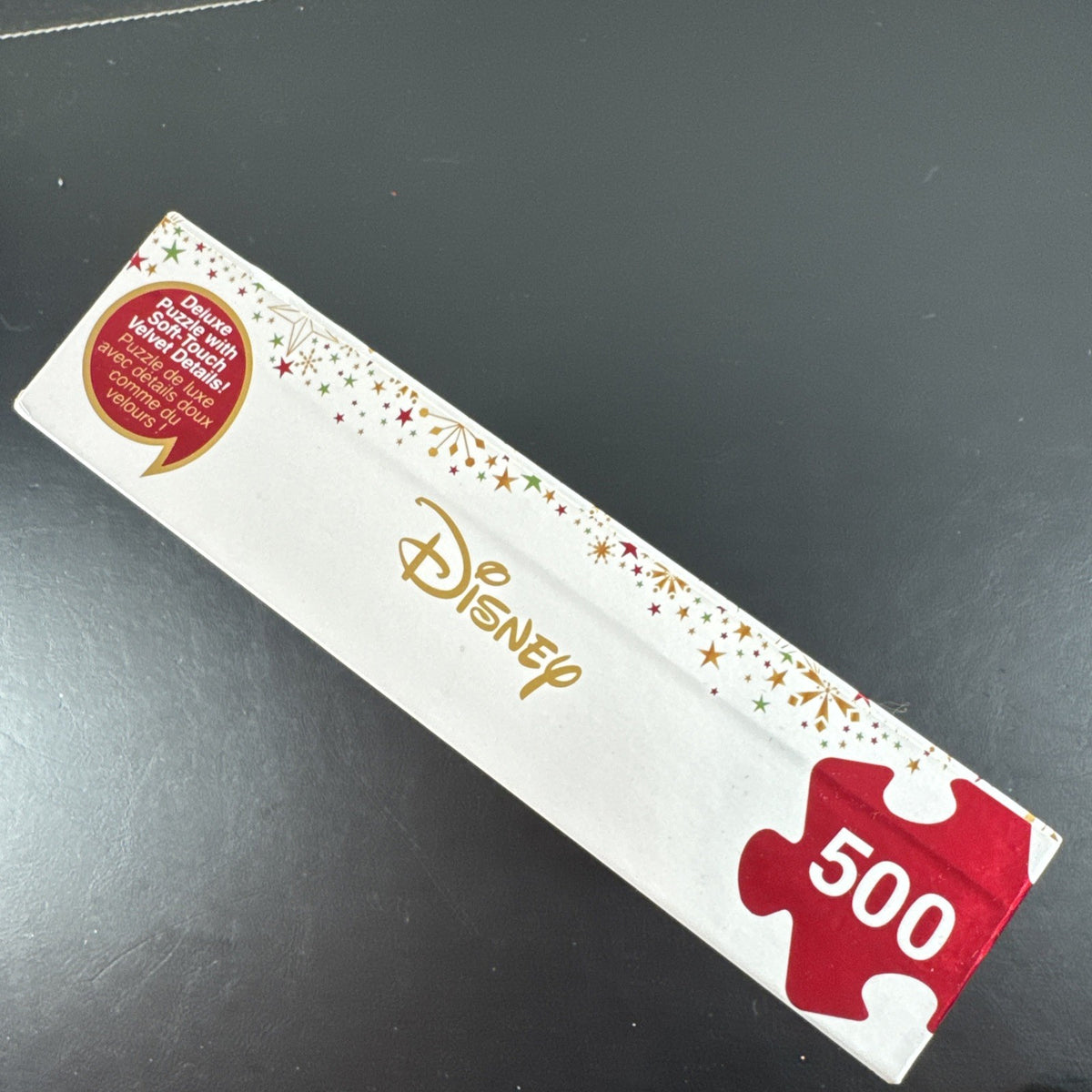New Disney Store 500-piece Christmas jigsaw puzzle featuring Mickey Mouse, Minnie Mouse, Pluto, and a snowman.