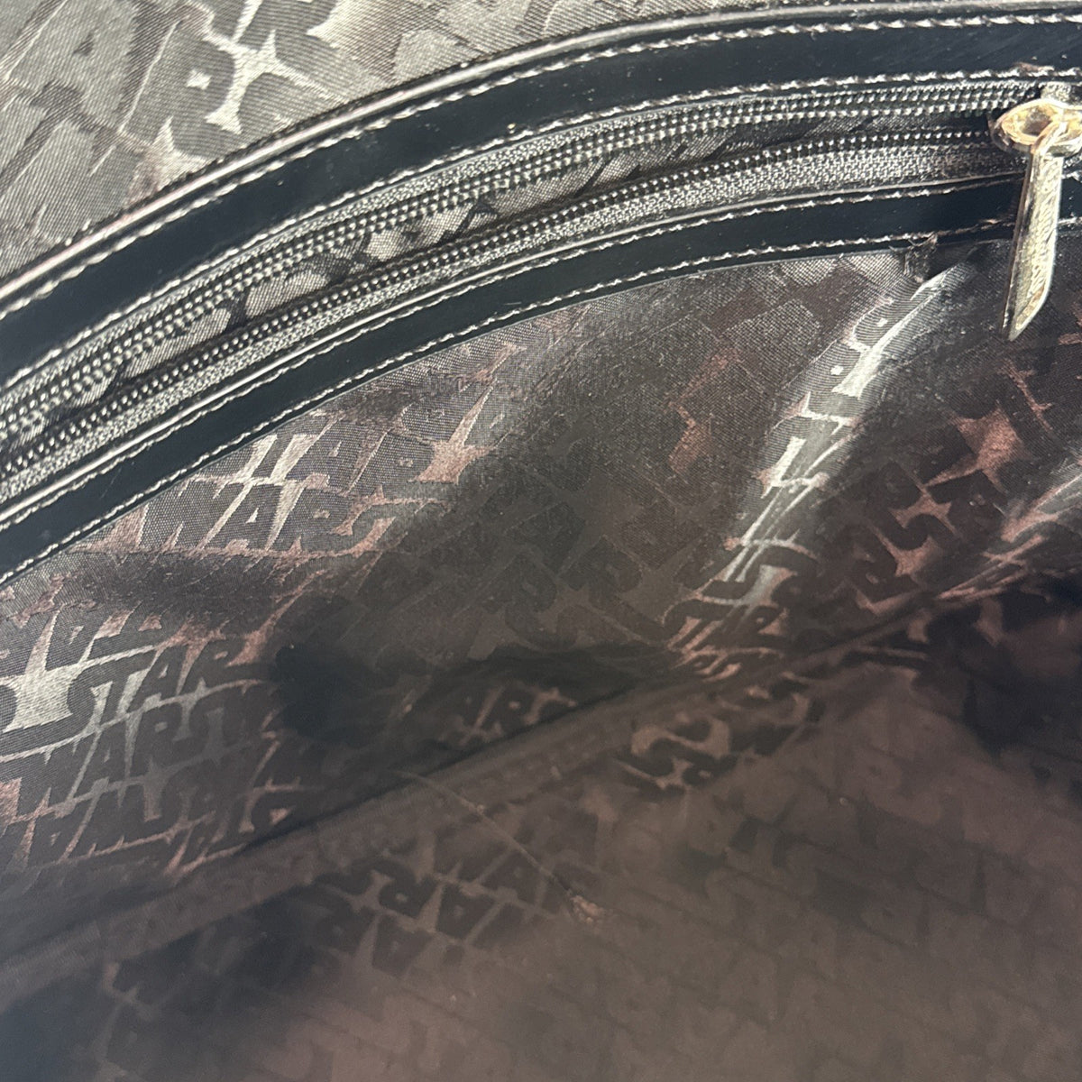 Loungefly Star Wars Darth Vader embossed black patent faux leather dome satchel bag showing logo plaque and double handles