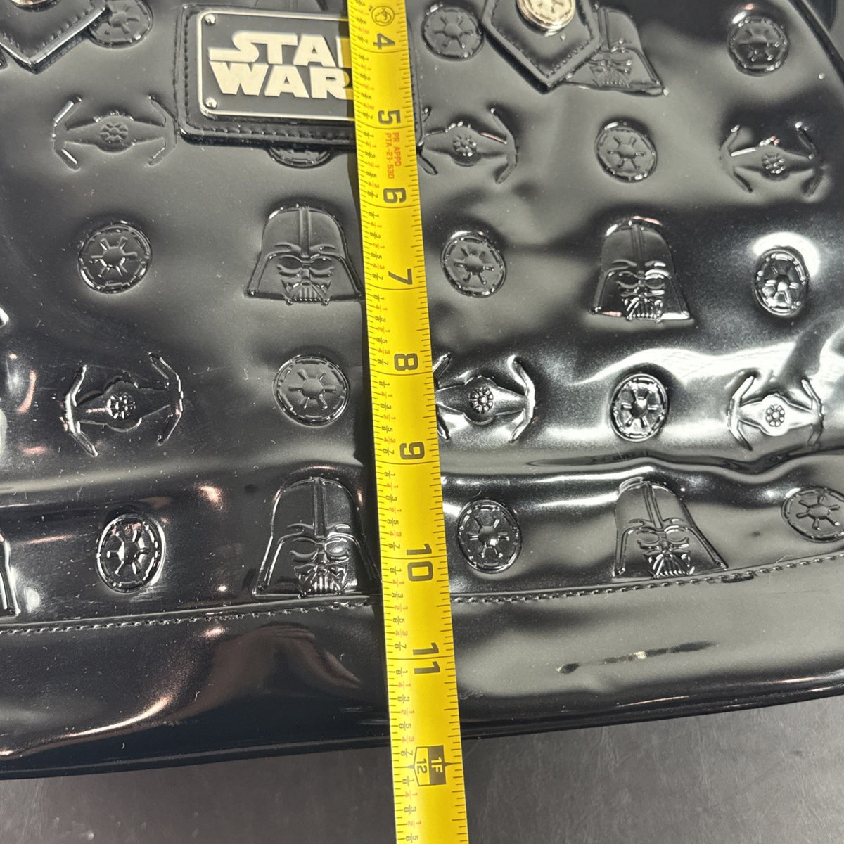 Loungefly Star Wars Darth Vader embossed black patent faux leather dome satchel bag showing logo plaque and double handles
