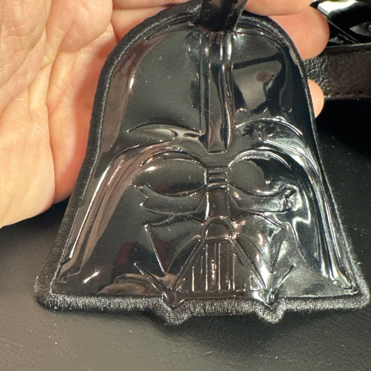 Loungefly Star Wars Darth Vader embossed black patent faux leather dome satchel bag showing logo plaque and double handles