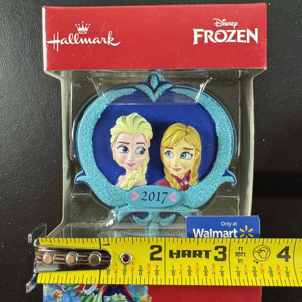2017 Hallmark Disney Frozen Elsa and Anna Christmas tree ornament in original packaging.