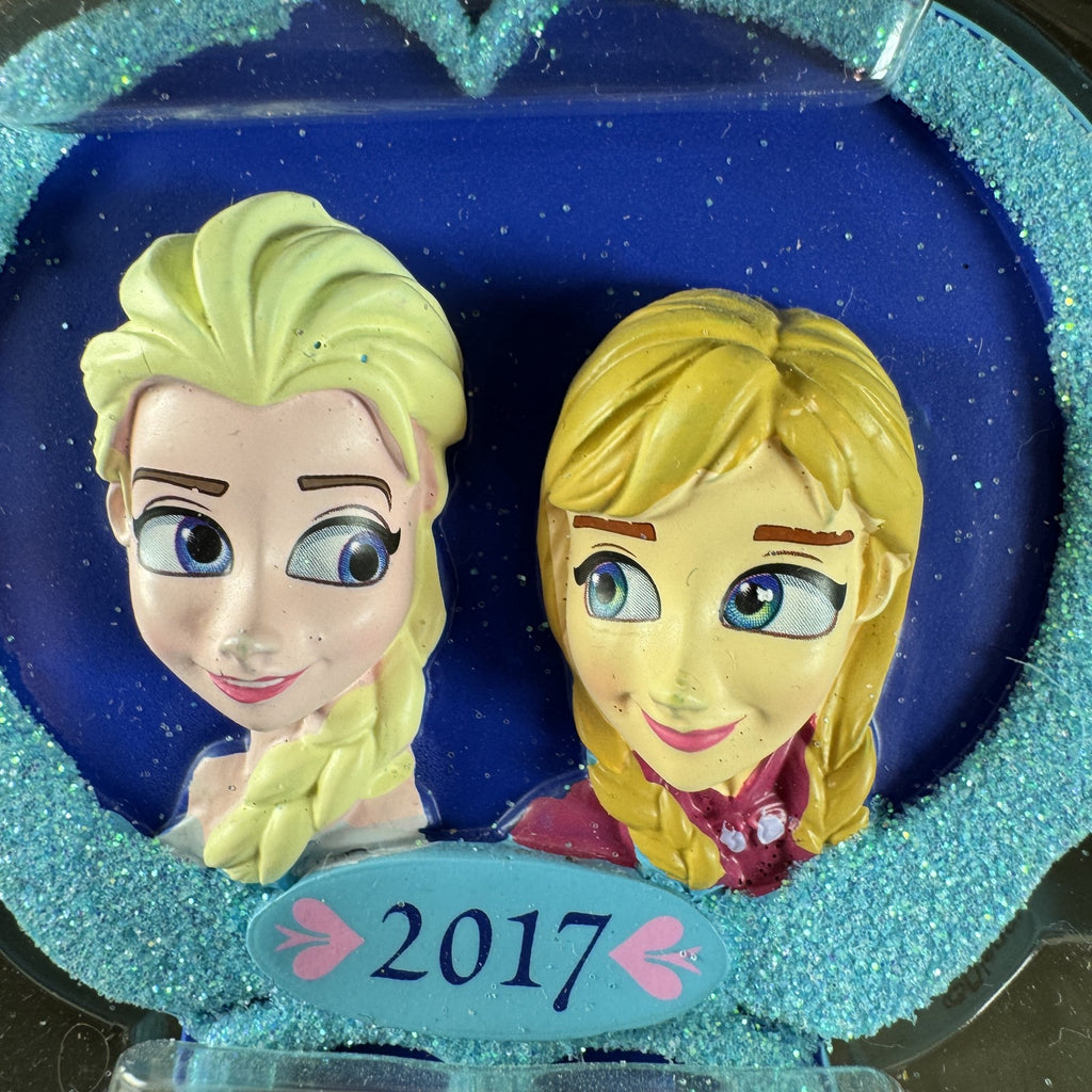 2017 Hallmark Disney Frozen Elsa and Anna Christmas tree ornament in original packaging.