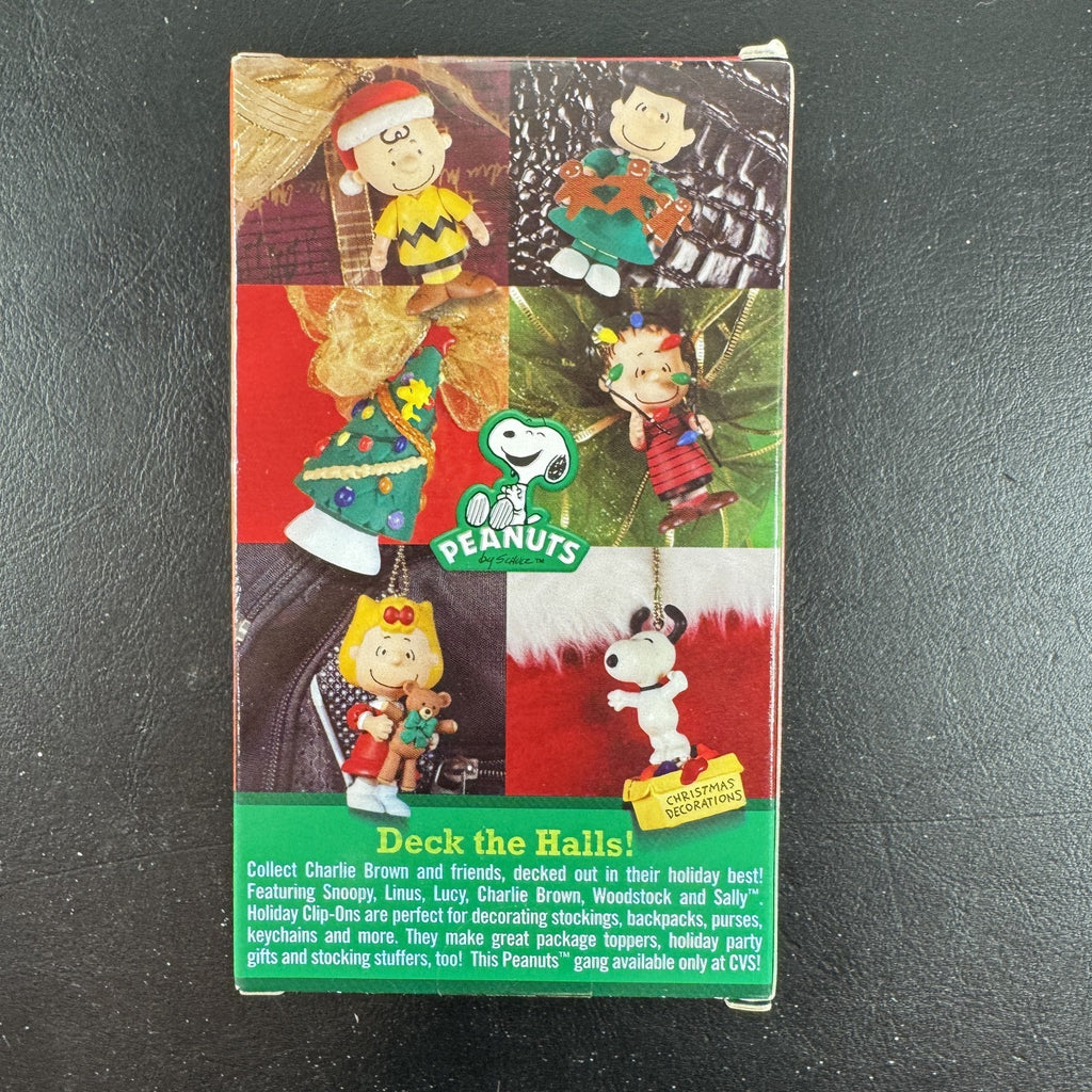 Forever Fun Peanuts Snoopy clip-on holiday ornament holding a Christmas decorations box in original packaging.