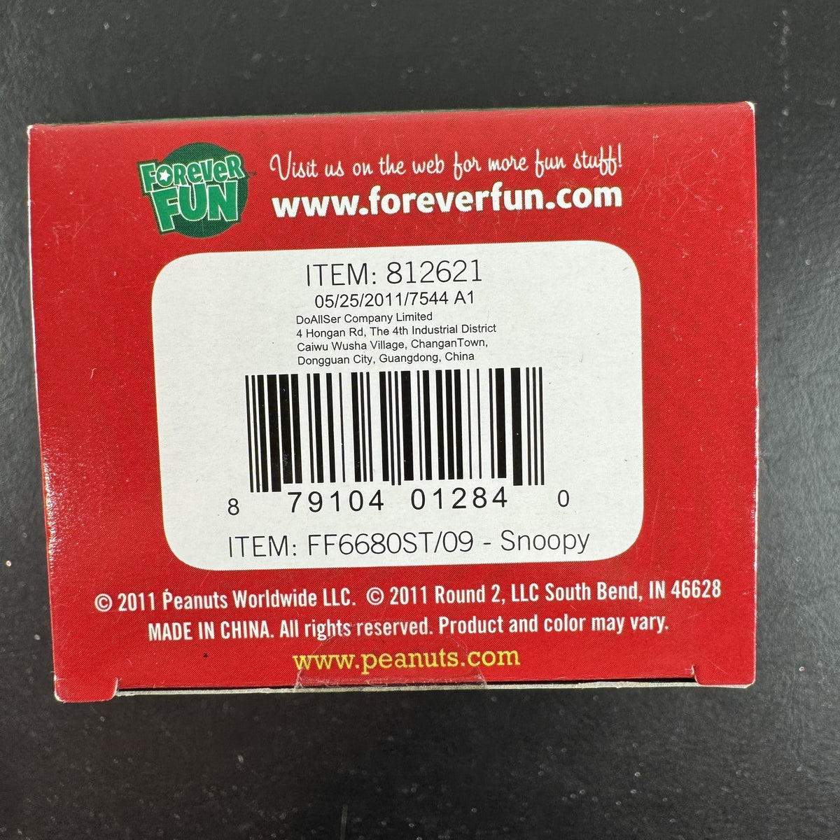 Forever Fun Peanuts Snoopy clip-on holiday ornament holding a Christmas decorations box in original packaging.