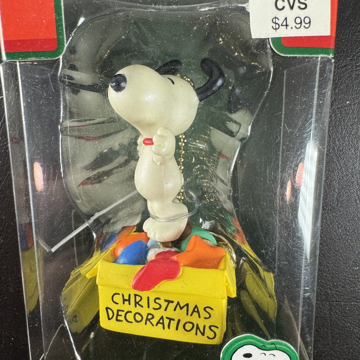 Forever Fun Peanuts Snoopy clip-on holiday ornament holding a Christmas decorations box in original packaging.