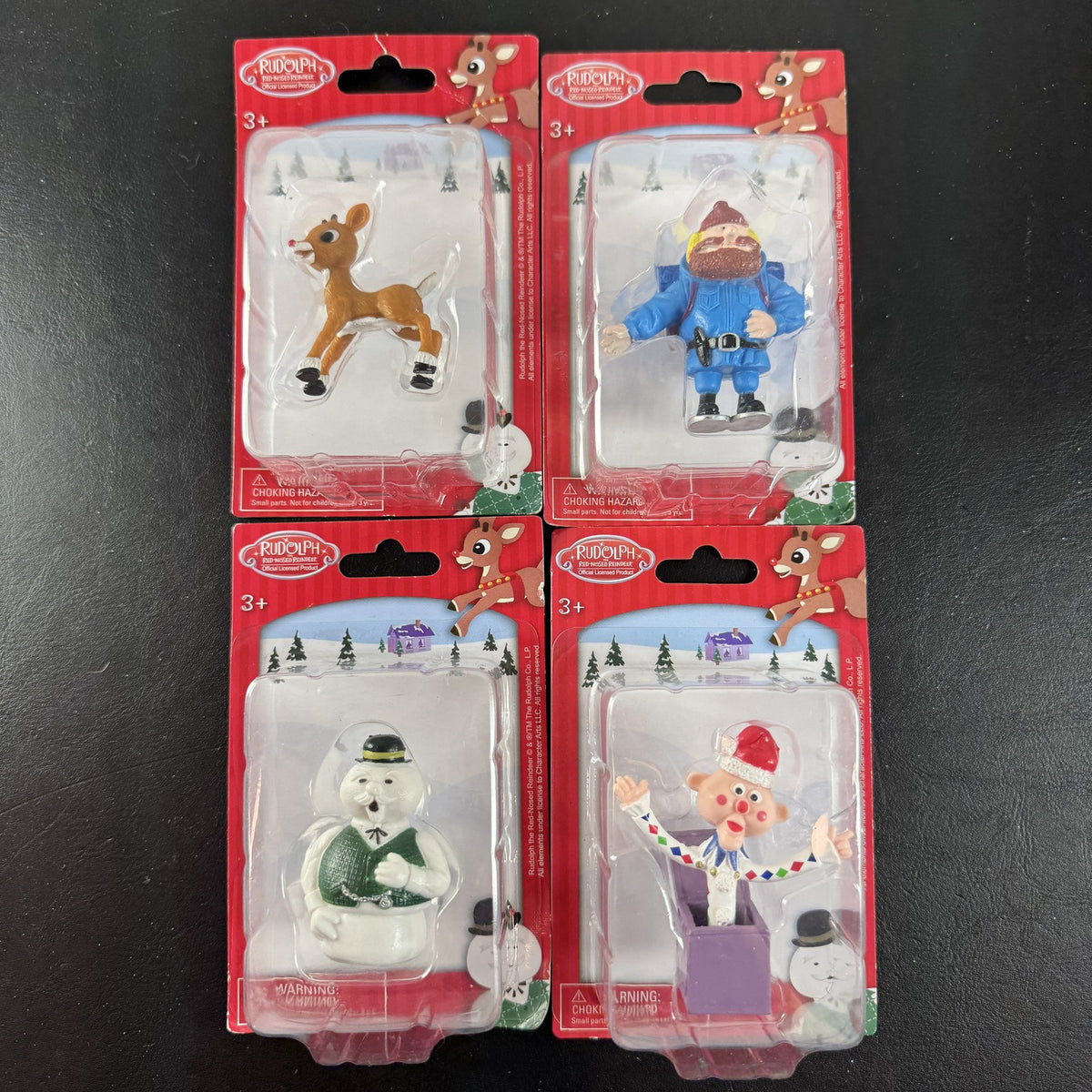 Character Arts Rudolph the Red-Nosed Reindeer set of 4 sealed mini figures including Yukon Cornelius and Sam the Snowman.