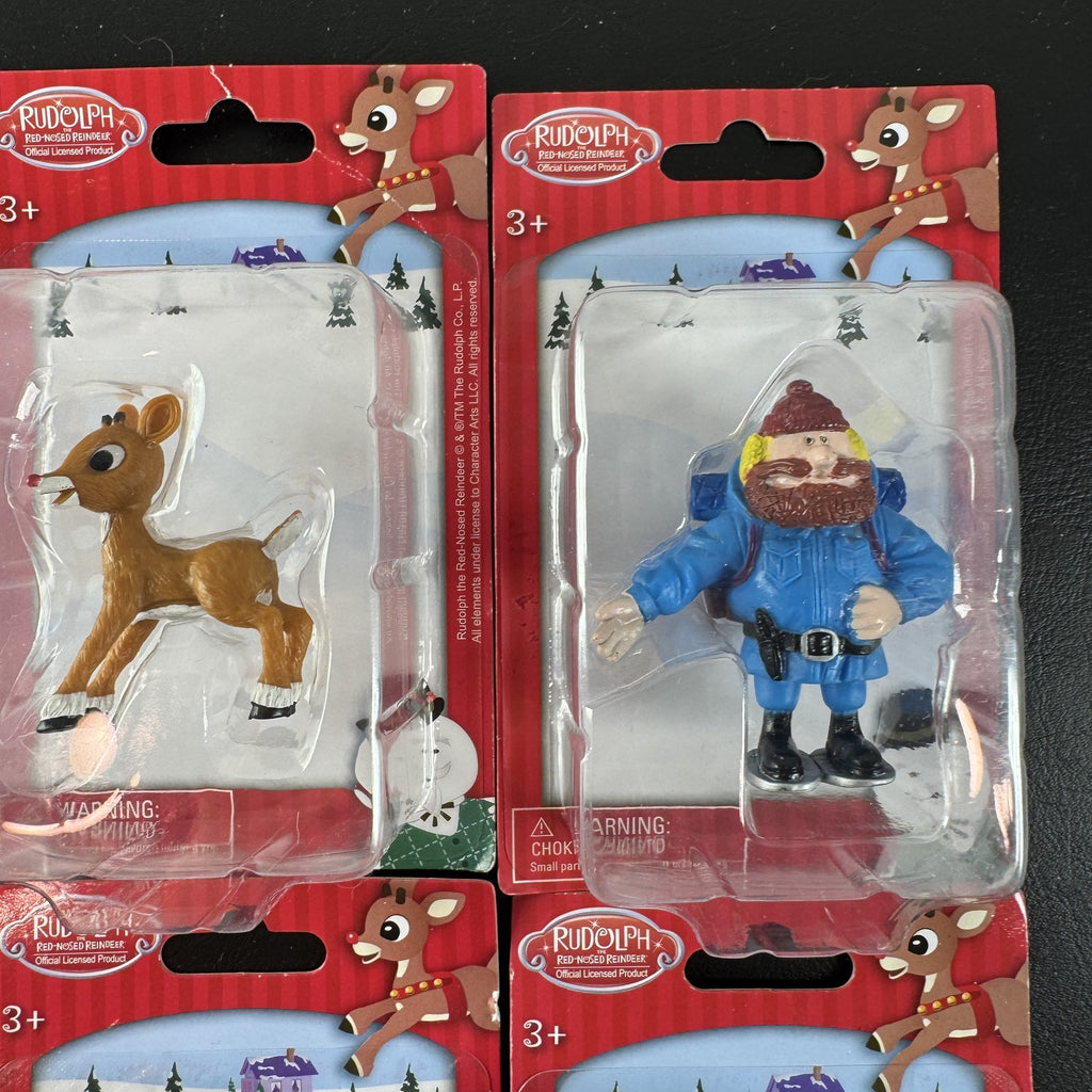 Character Arts Rudolph the Red-Nosed Reindeer set of 4 sealed mini figures including Yukon Cornelius and Sam the Snowman.