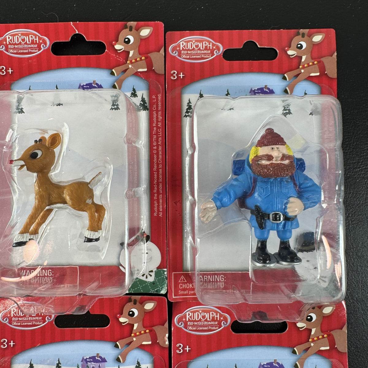 Character Arts Rudolph the Red-Nosed Reindeer set of 4 sealed mini figures including Yukon Cornelius and Sam the Snowman.