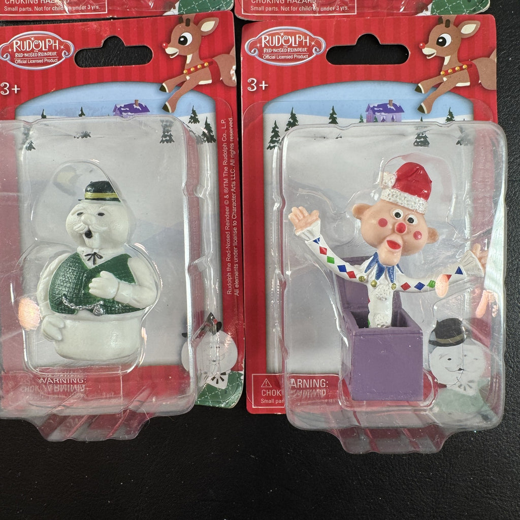 Character Arts Rudolph the Red-Nosed Reindeer set of 4 sealed mini figures including Yukon Cornelius and Sam the Snowman.