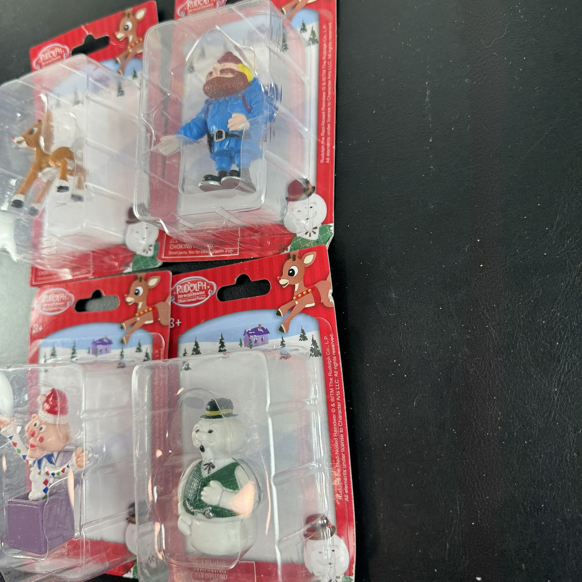 Character Arts Rudolph the Red-Nosed Reindeer set of 4 sealed mini figures including Yukon Cornelius and Sam the Snowman.