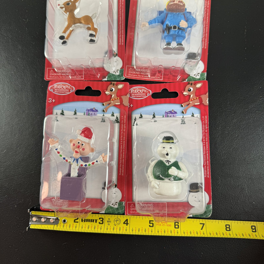 Character Arts Rudolph the Red-Nosed Reindeer set of 4 sealed mini figures including Yukon Cornelius and Sam the Snowman.