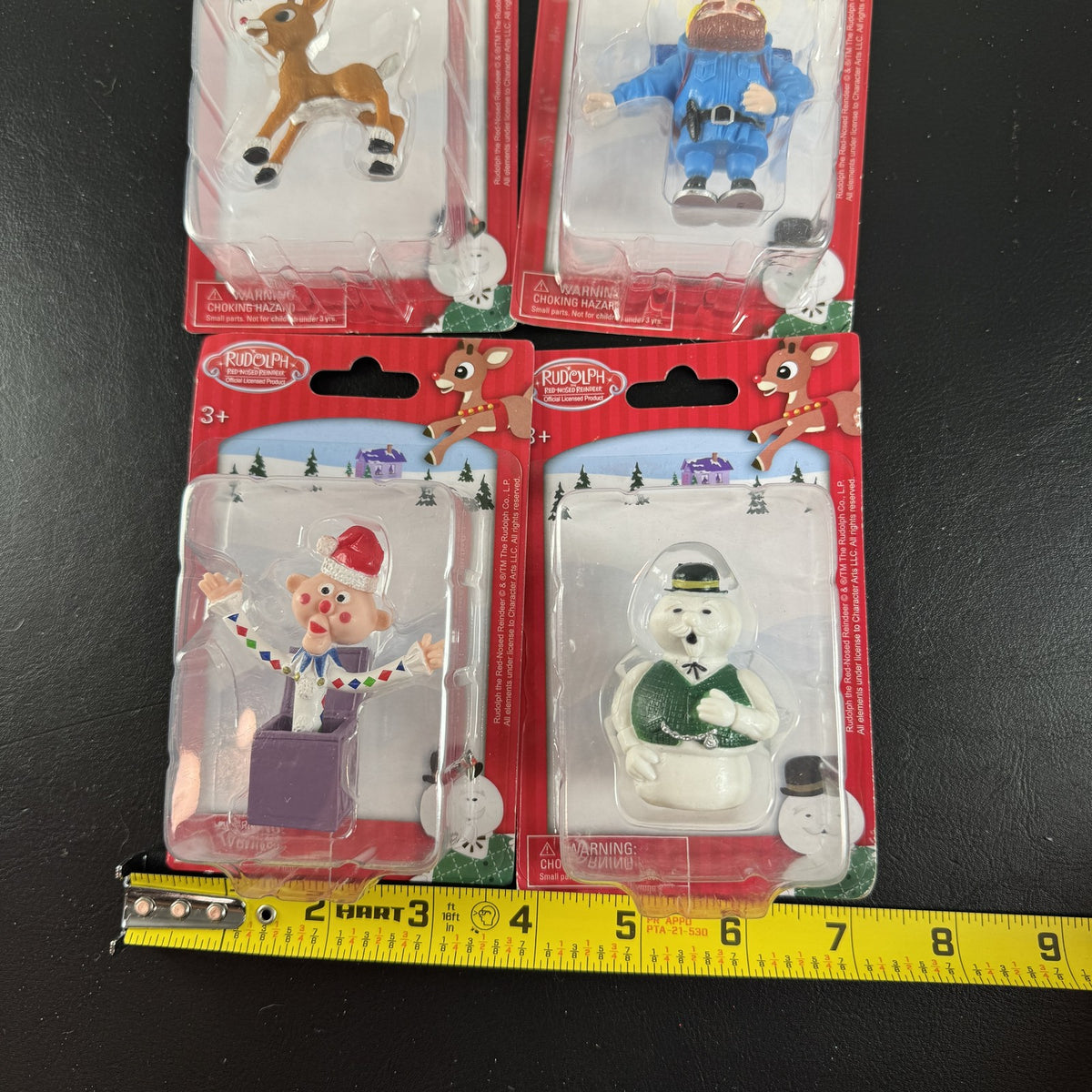 Character Arts Rudolph the Red-Nosed Reindeer set of 4 sealed mini figures including Yukon Cornelius and Sam the Snowman.