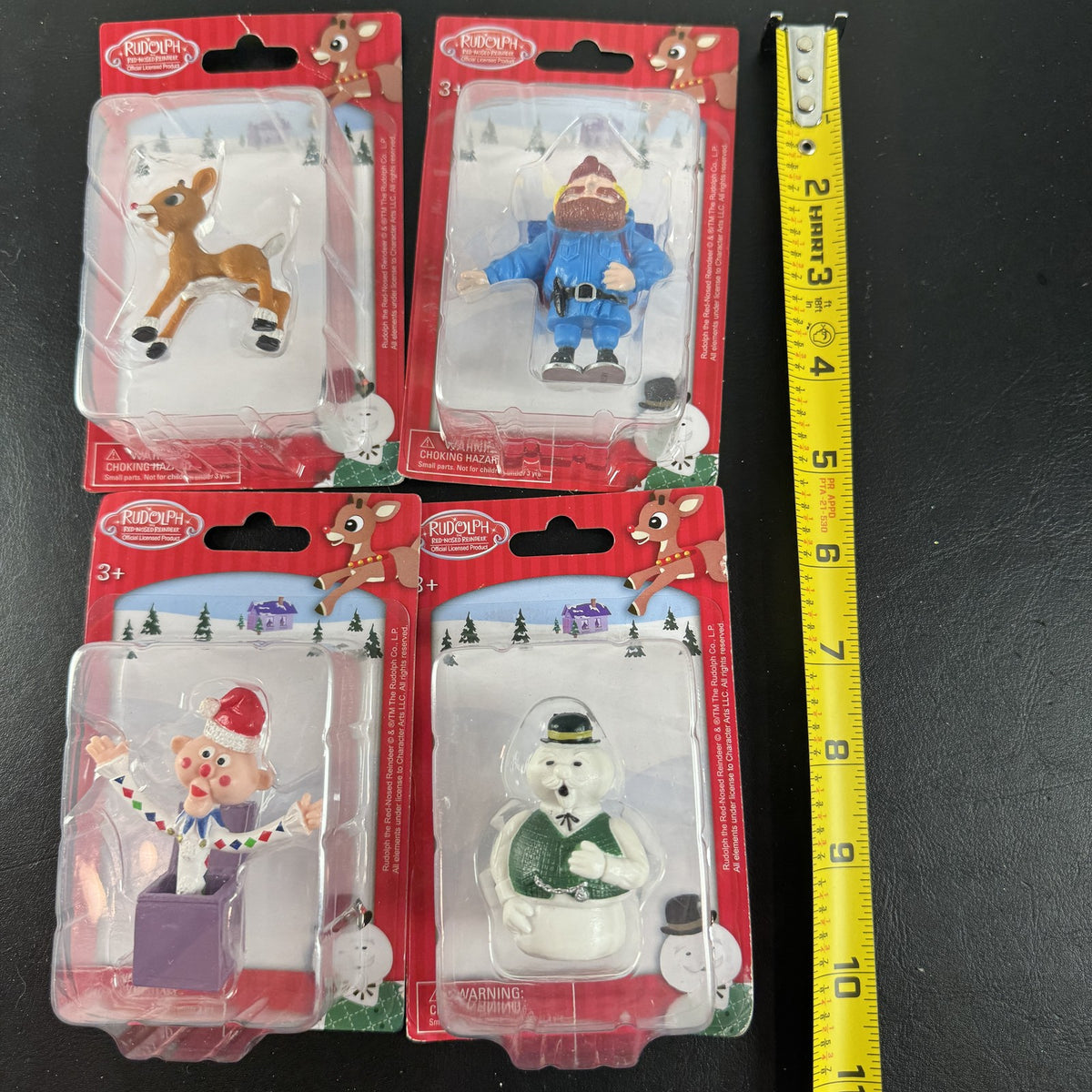 Character Arts Rudolph the Red-Nosed Reindeer set of 4 sealed mini figures including Yukon Cornelius and Sam the Snowman.