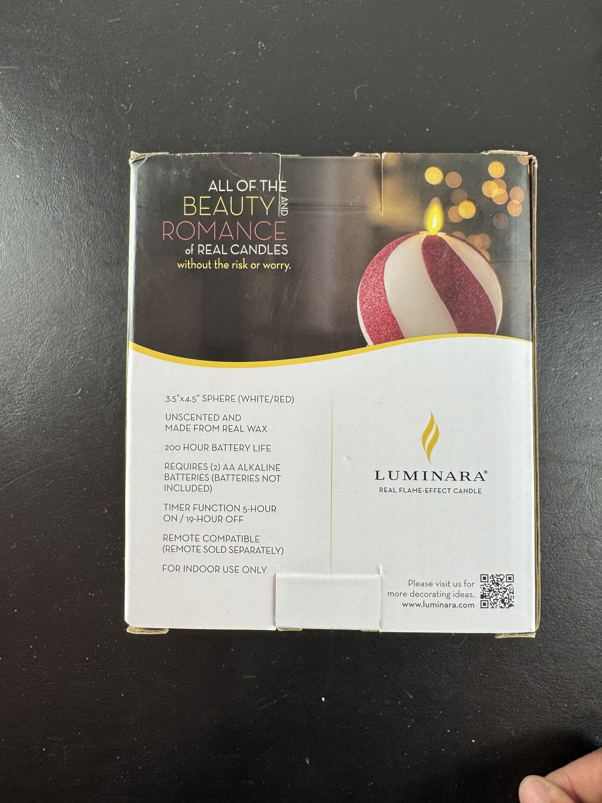 Luminara 3.5x4.5 red glitter swirl sphere real wax flameless LED candle in original packaging.