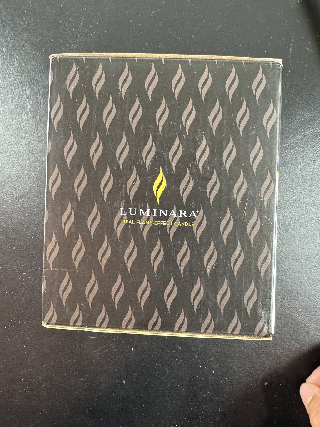 Luminara 3.5x4.5 red glitter swirl sphere real wax flameless LED candle in original packaging.