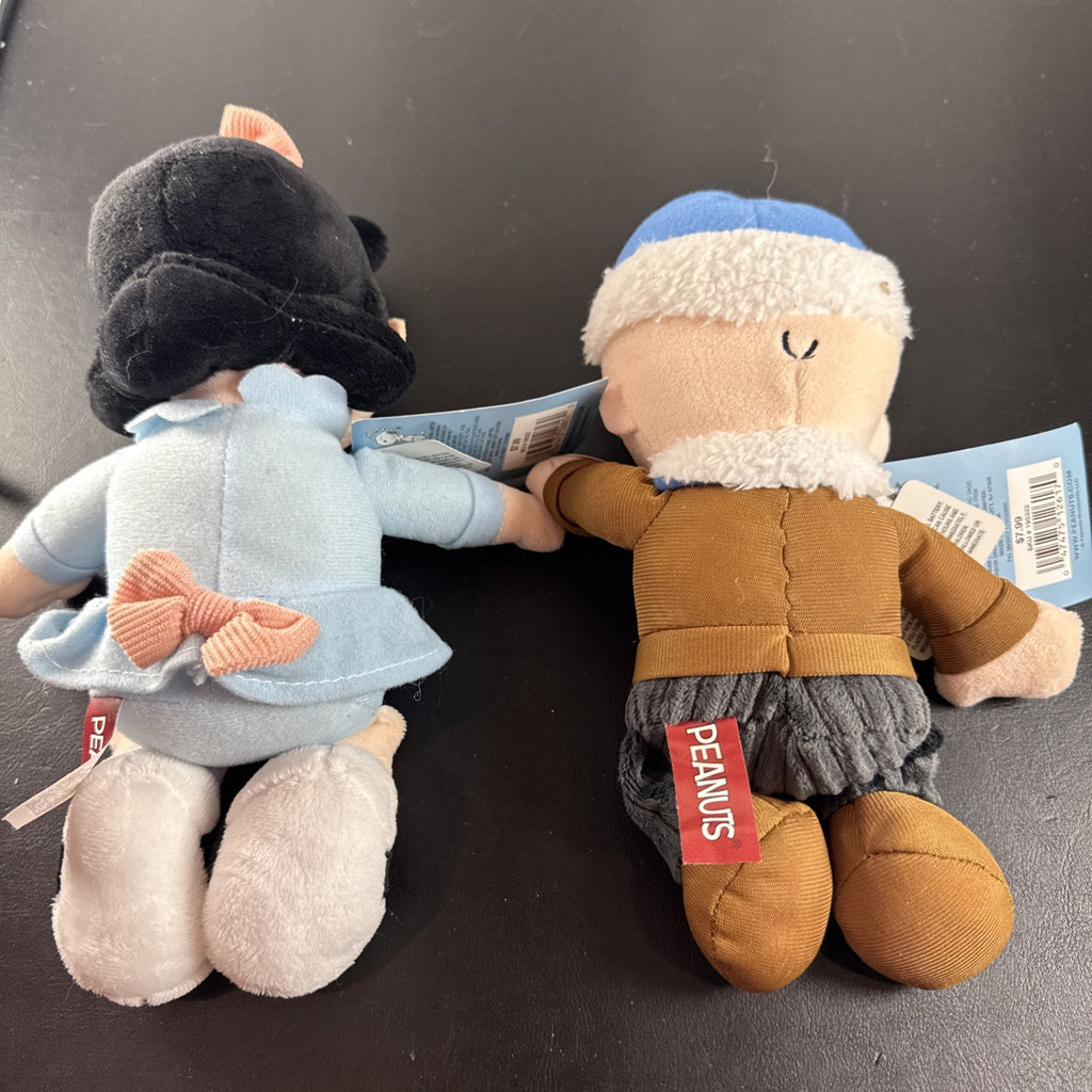 Peanuts 10-inch musical holiday plush figures set featuring Charlie Brown and Lucy in winter outfits