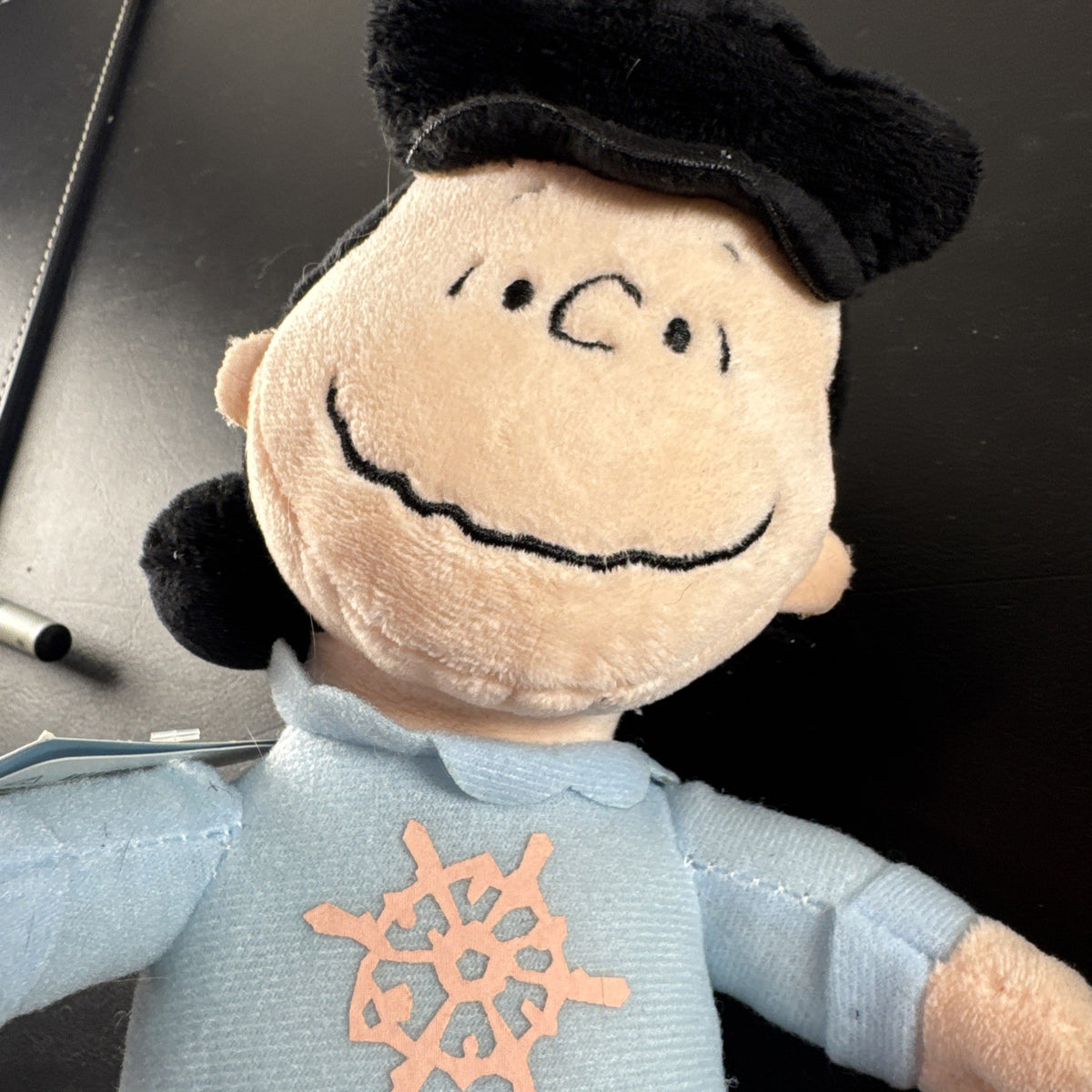 Peanuts 10-inch musical holiday plush figures set featuring Charlie Brown and Lucy in winter outfits