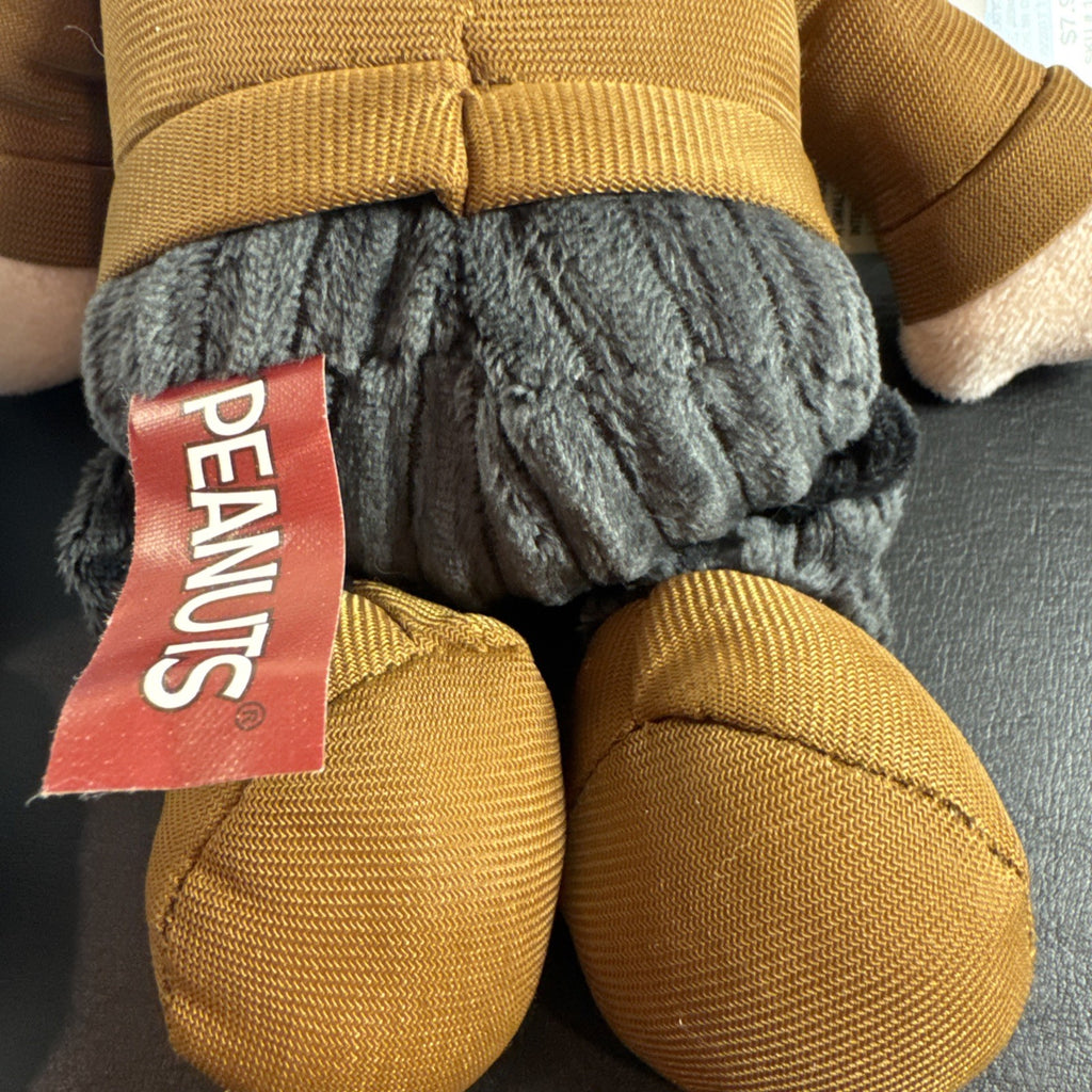 Peanuts 10-inch musical holiday plush figures set featuring Charlie Brown and Lucy in winter outfits