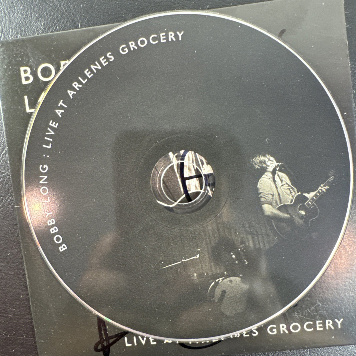 Autographed Bobby Long 2009 CD collection and signed Whisky a Go Go concert ticket stub lot.