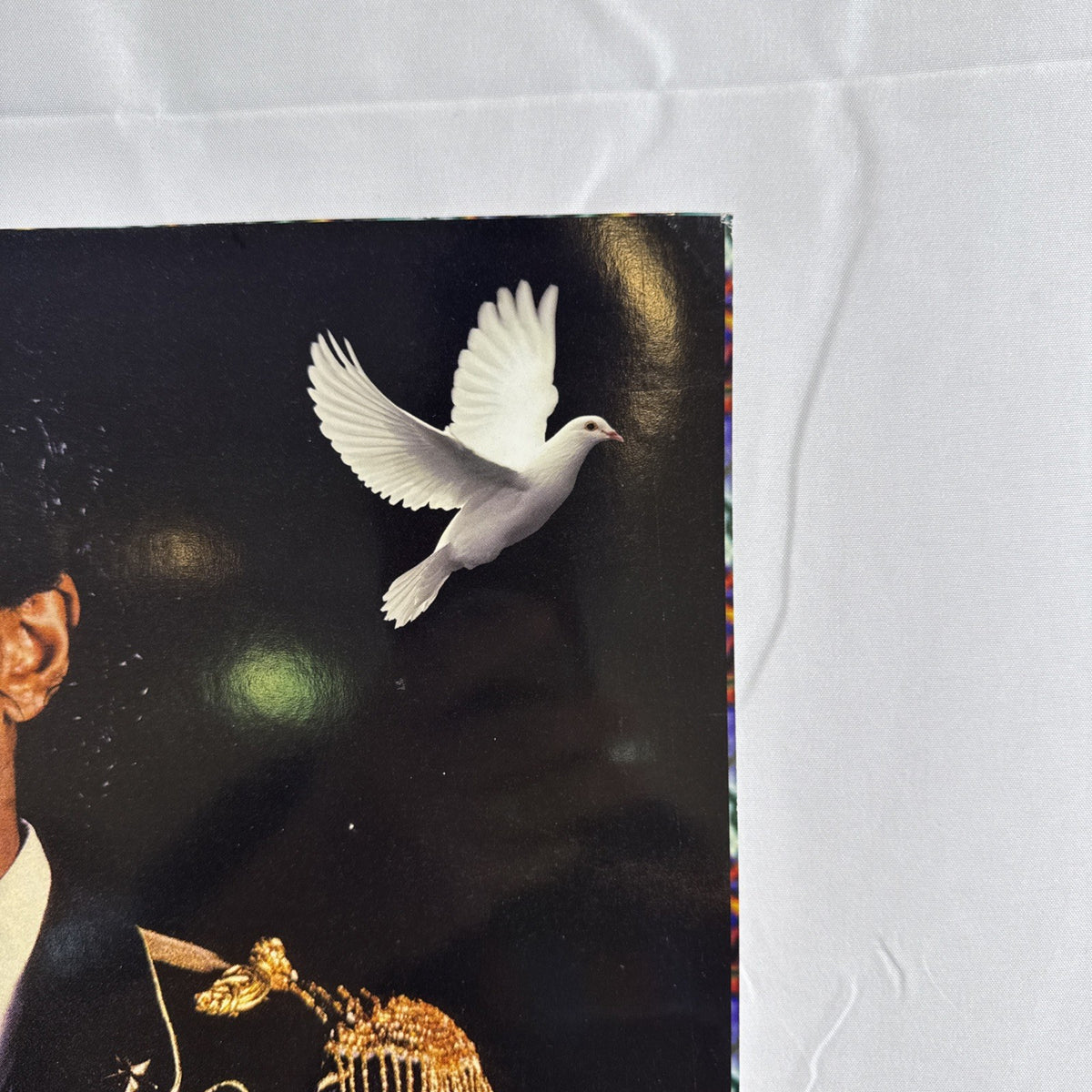 Michael Jackson 2009 memorial tribute promo poster featuring portrait in military jacket and white dove graphic.
