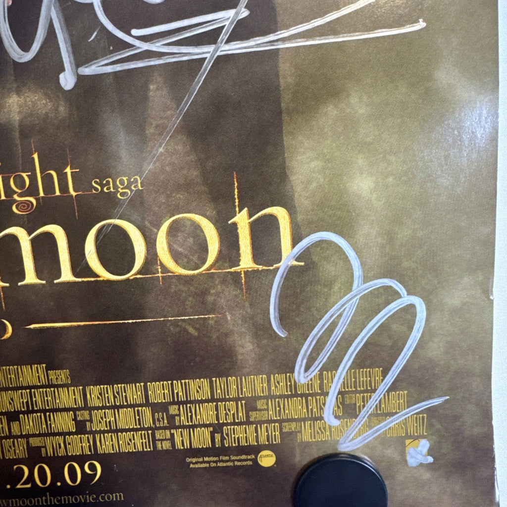 Original 2009 Twilight New Moon promotional 11x17 poster signed in silver marker by cast members.
