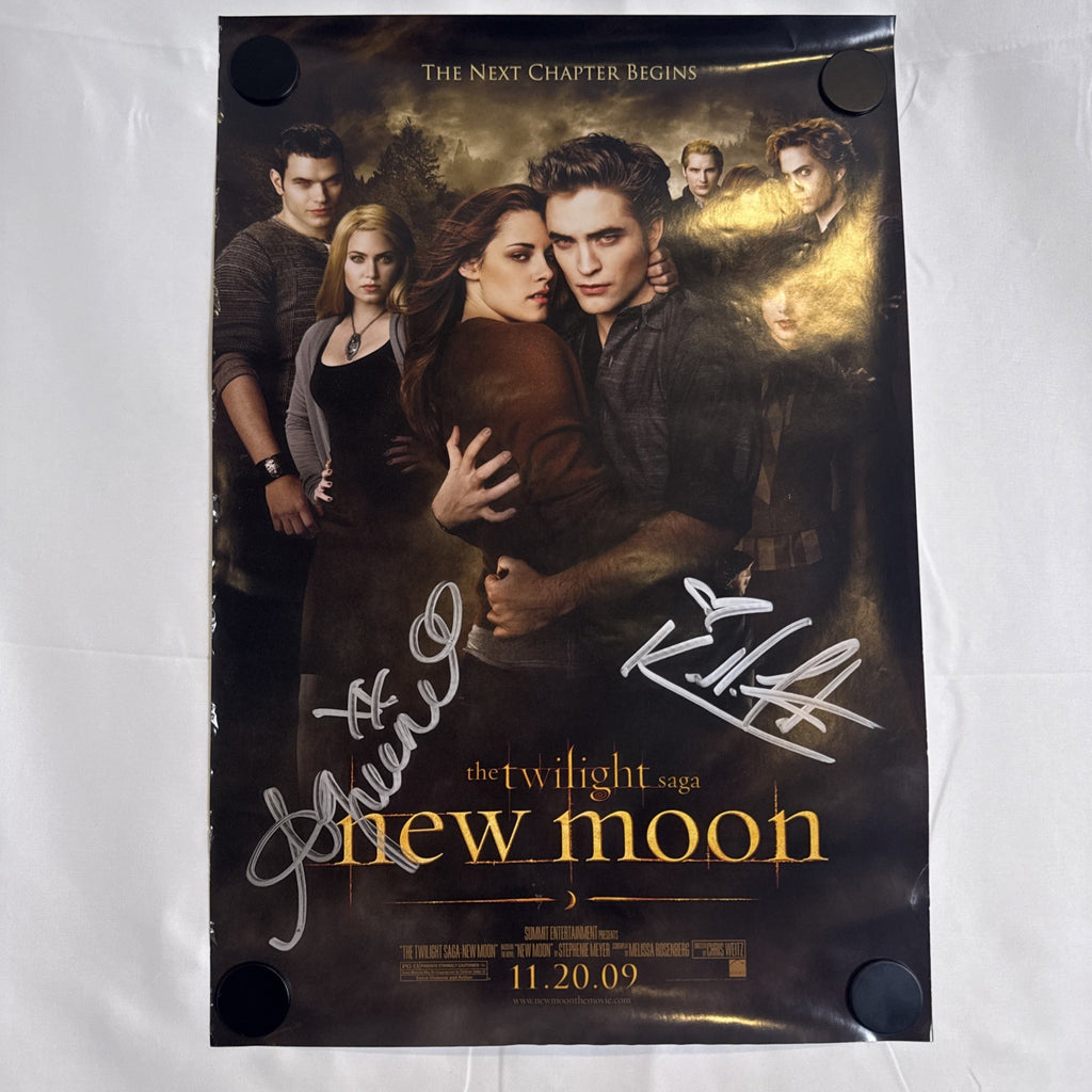 11x17 Twilight New Moon promotional poster signed in silver marker by Ashley Greene and Kellan Lutz.