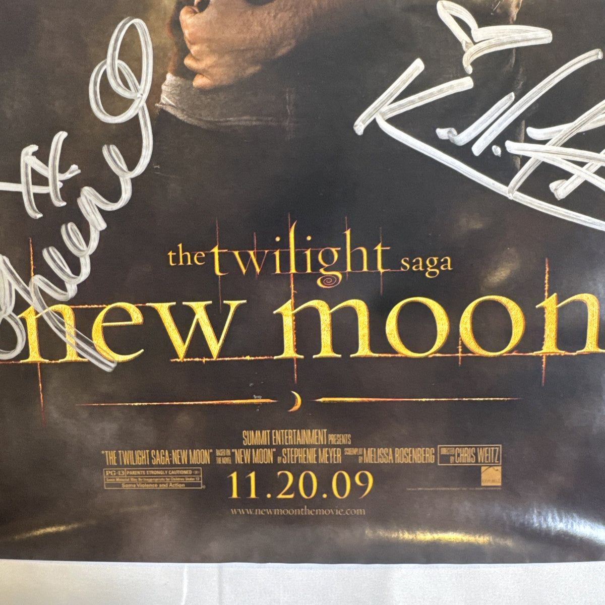 11x17 Twilight New Moon promotional poster signed in silver marker by Ashley Greene and Kellan Lutz.