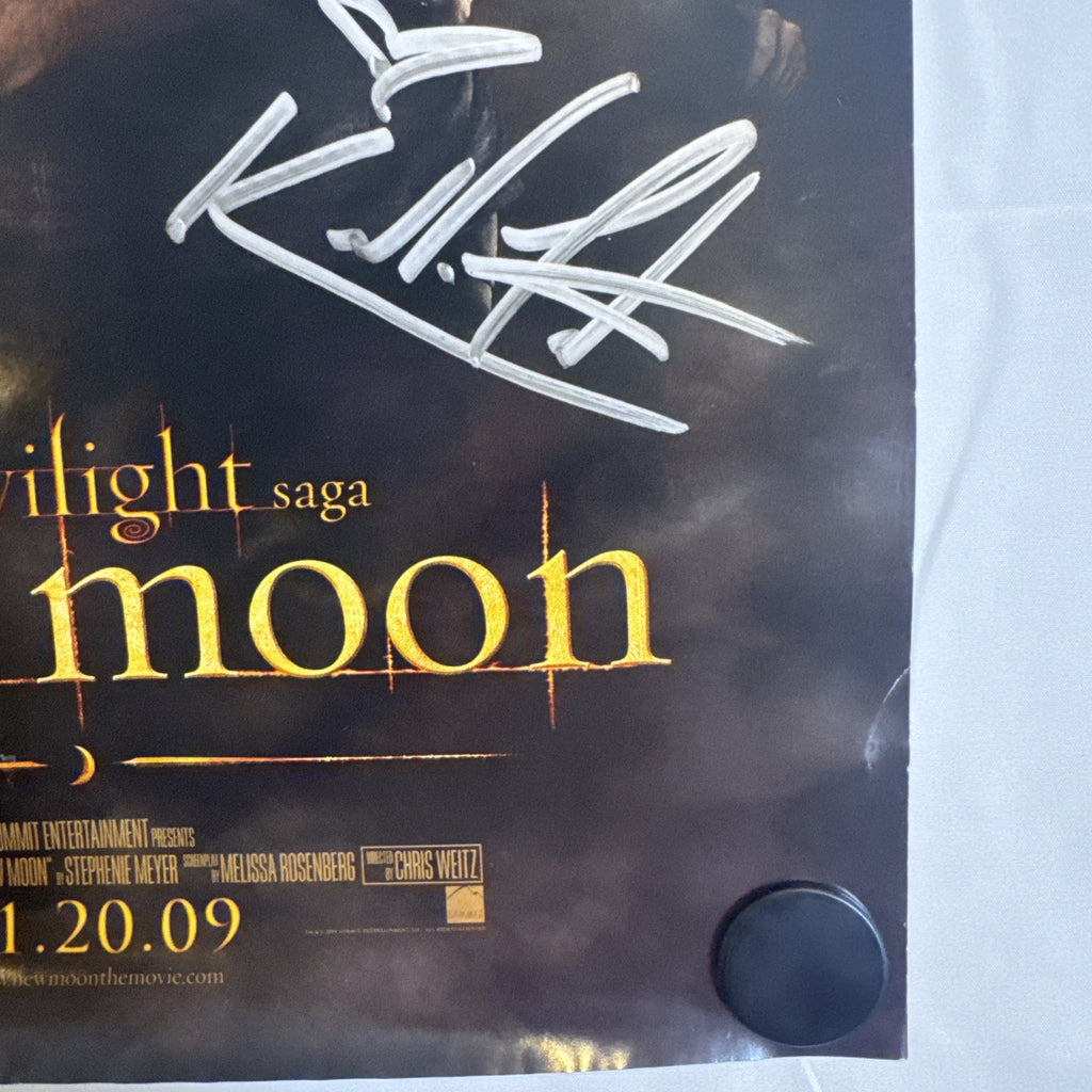 11x17 Twilight New Moon promotional poster signed in silver marker by Ashley Greene and Kellan Lutz.