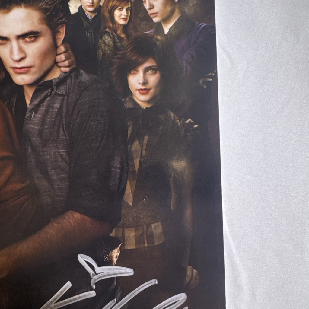 11x17 Twilight New Moon promotional poster signed in silver marker by Ashley Greene and Kellan Lutz.