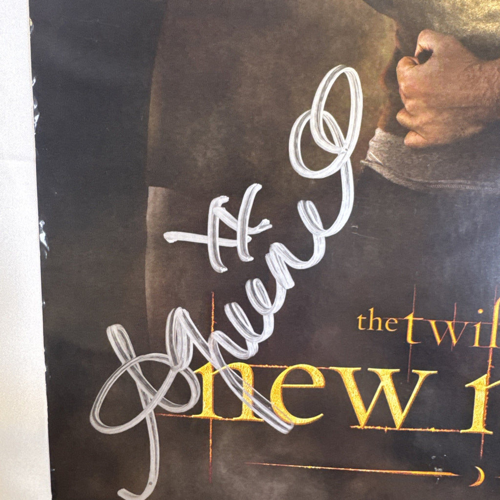 11x17 Twilight New Moon promotional poster signed in silver marker by Ashley Greene and Kellan Lutz.