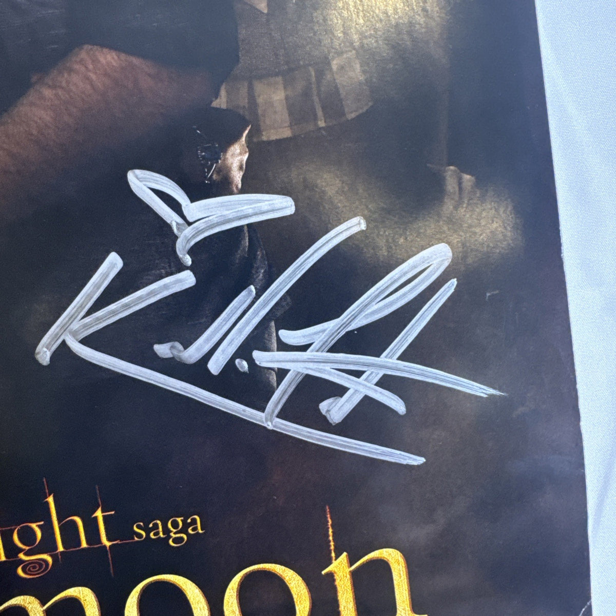 11x17 Twilight New Moon promotional poster signed in silver marker by Ashley Greene and Kellan Lutz.
