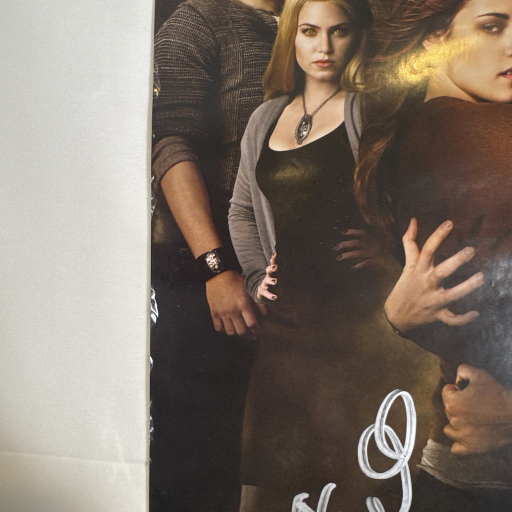 11x17 Twilight New Moon promotional poster signed in silver marker by Ashley Greene and Kellan Lutz.