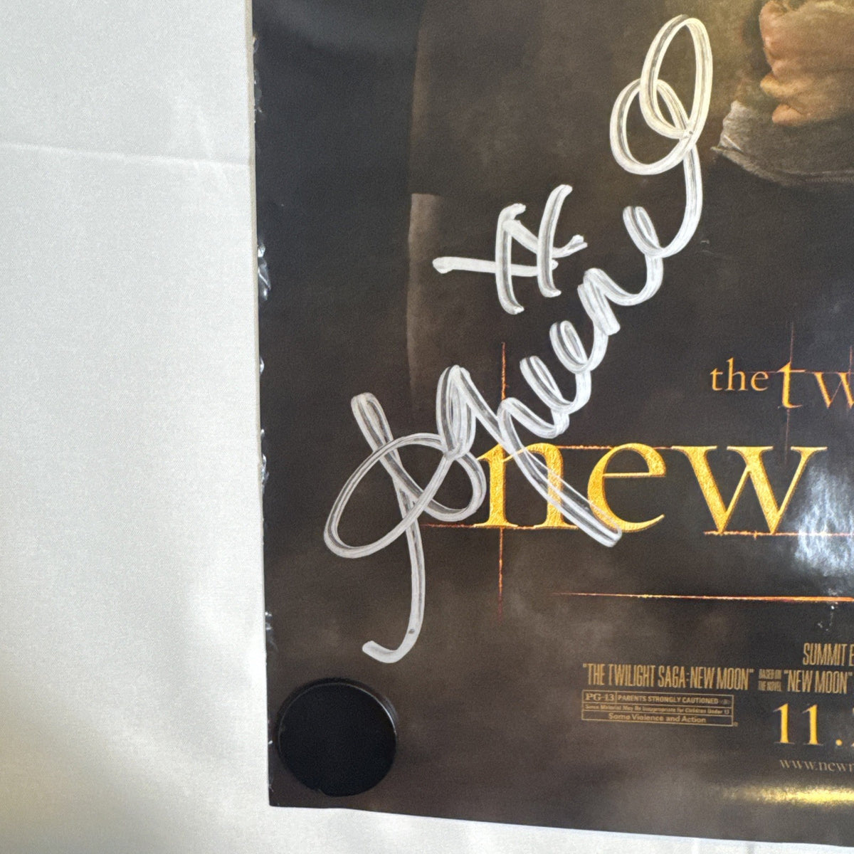 11x17 Twilight New Moon promotional poster signed in silver marker by Ashley Greene and Kellan Lutz.