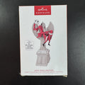 Hallmark Keepsake Jack Skellington musical Christmas ornament draped over cemetery angel